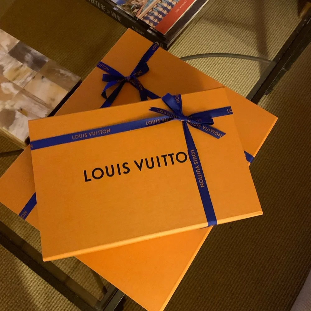 Brand new authentic smaller Luis Vuitton box with ribbon . Must have for closet!